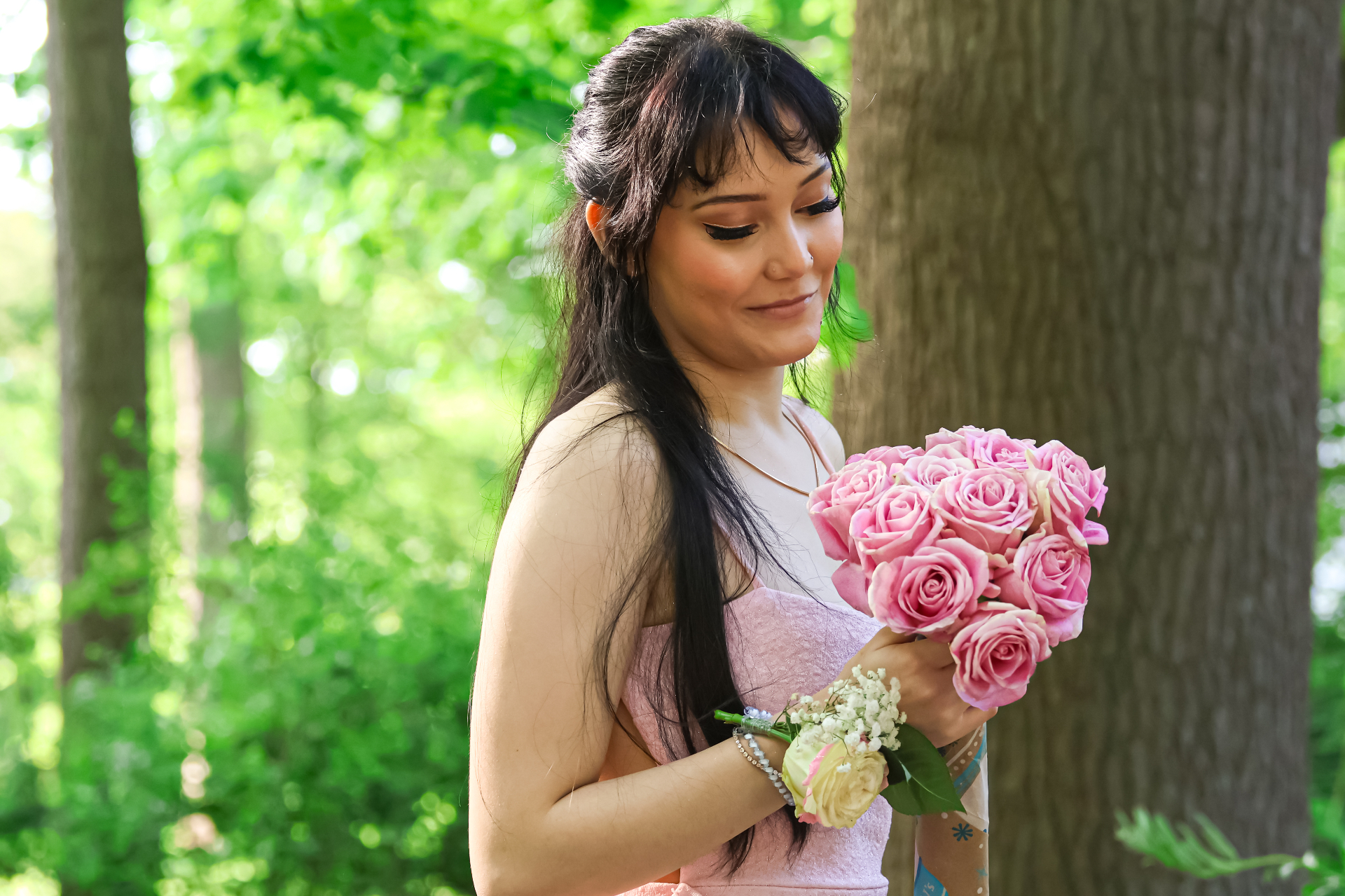 Pink bouquet portrait by tree