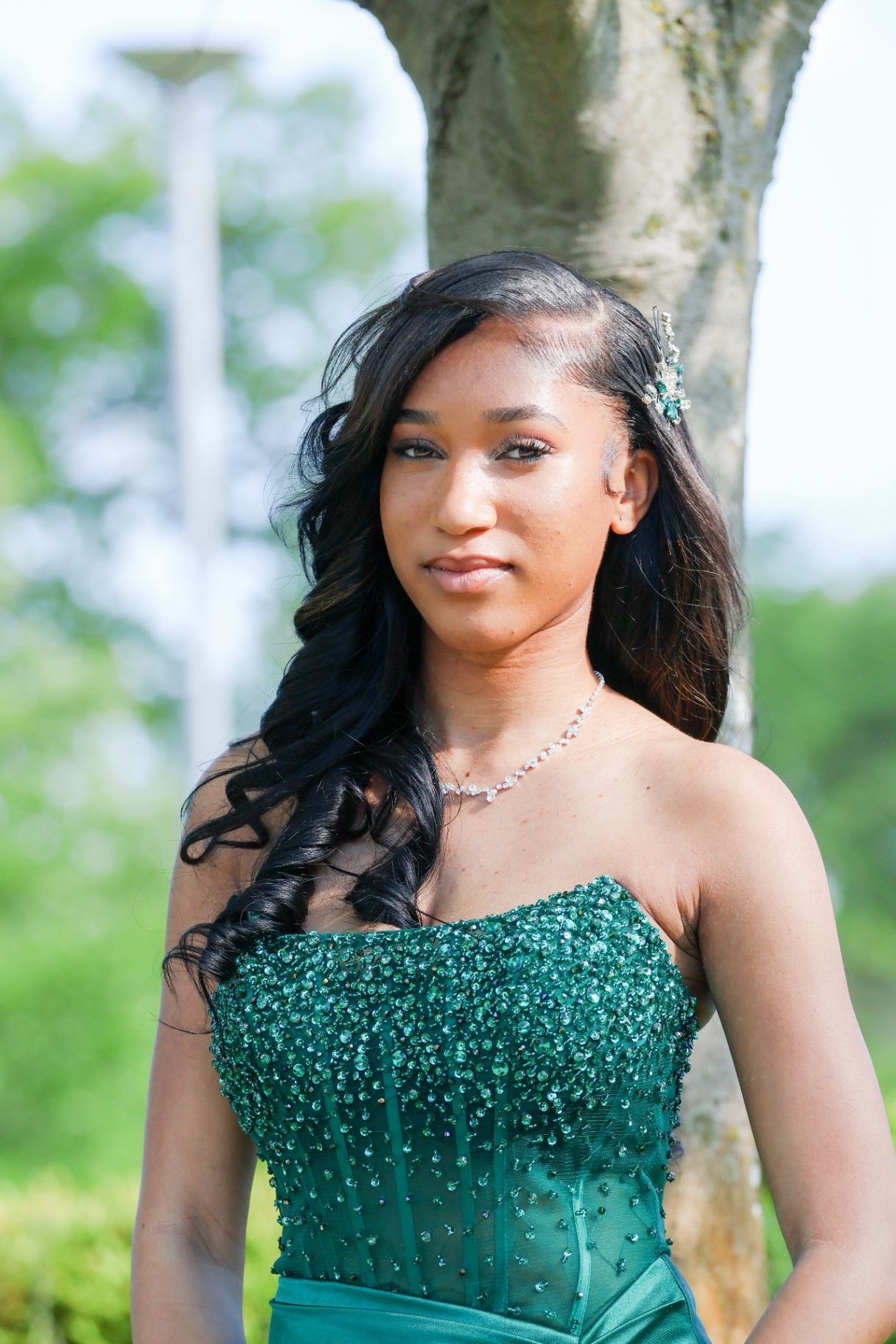 Prom close-up portrait by tree