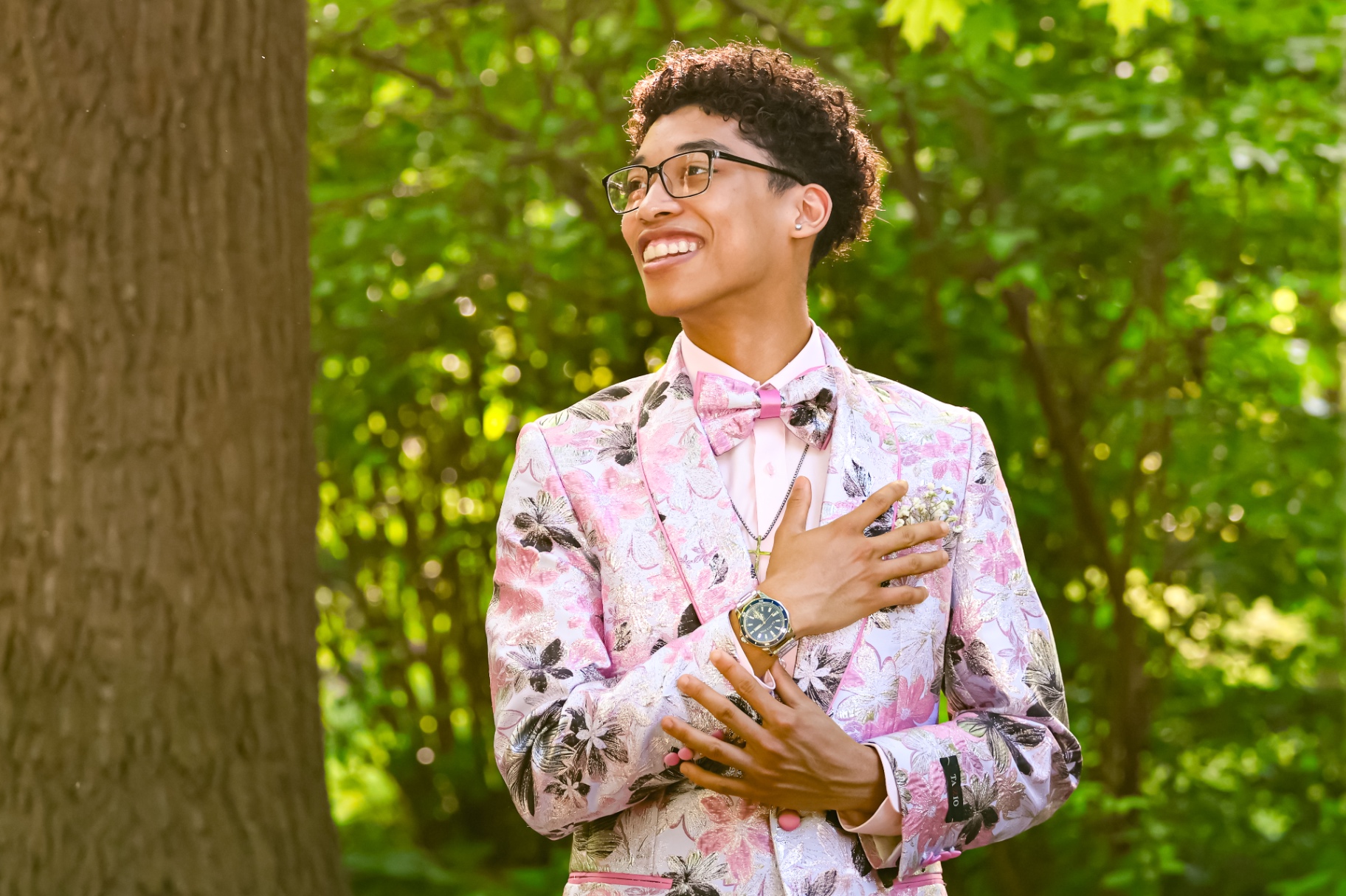 Pink tux prom portrait in woods