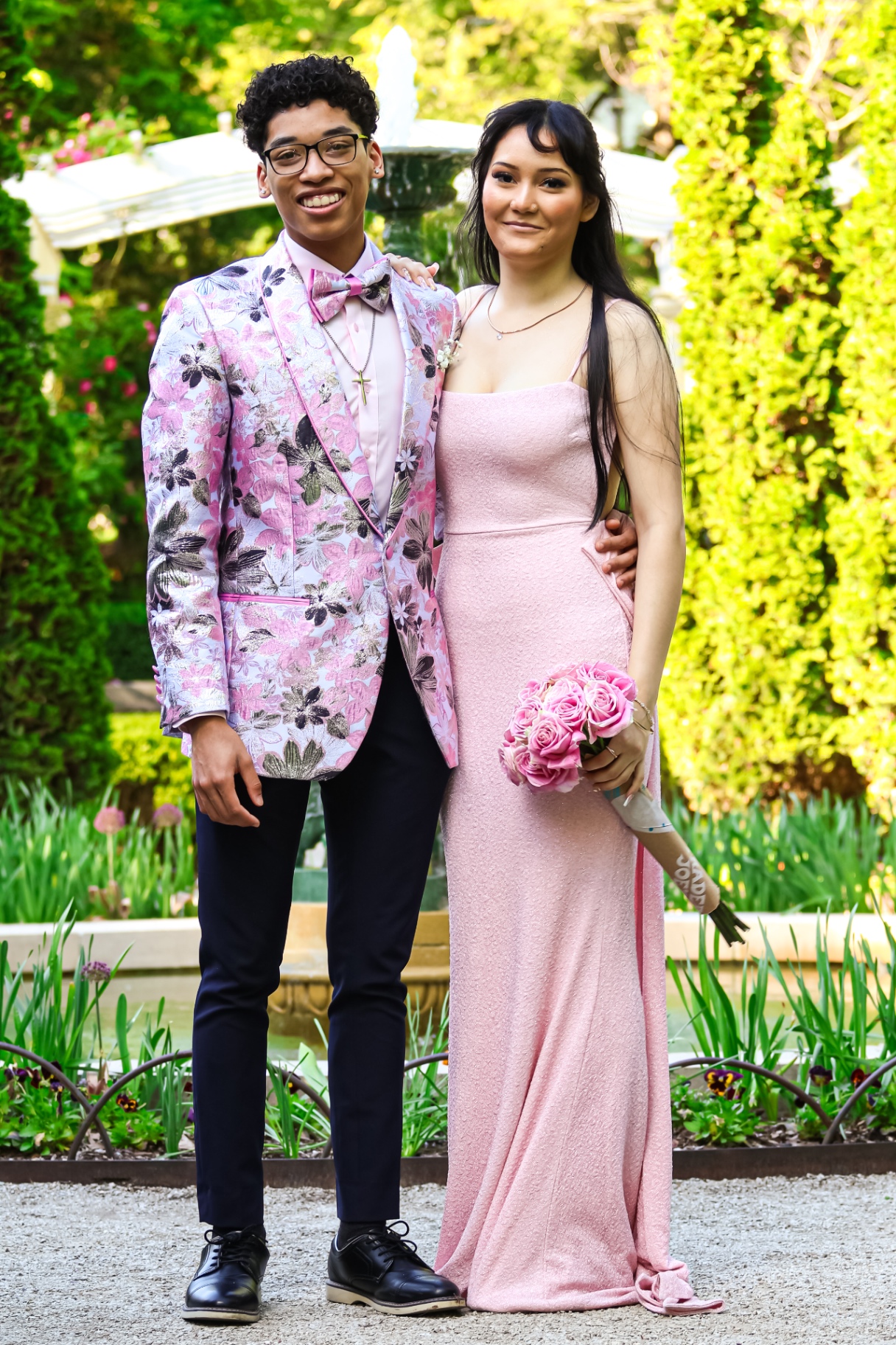 Prom couple portrait by fountain