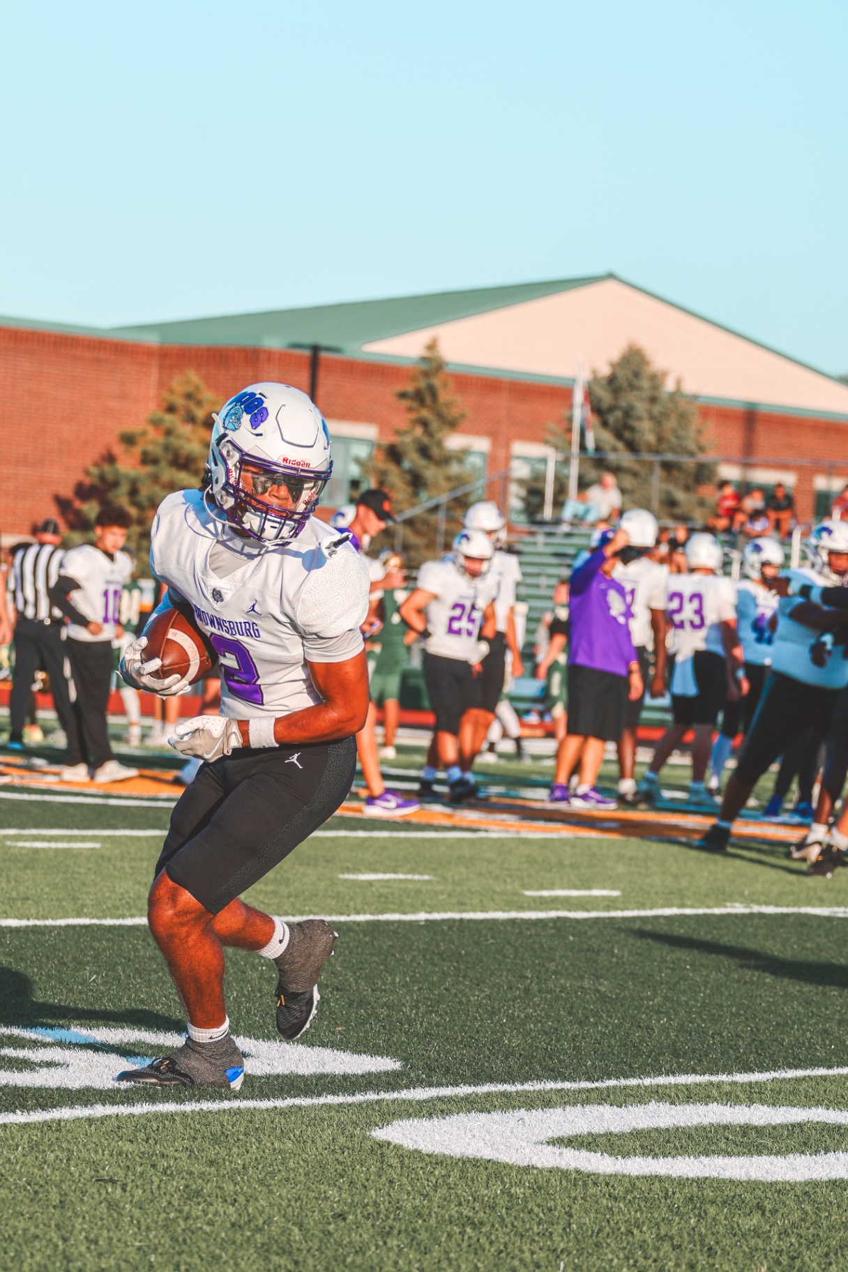 Football player running with ball