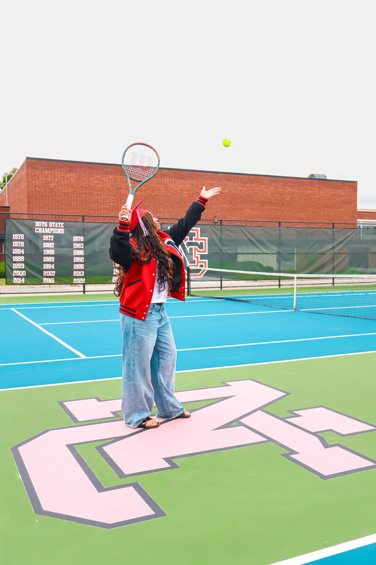 Senior serving on NC tennis court