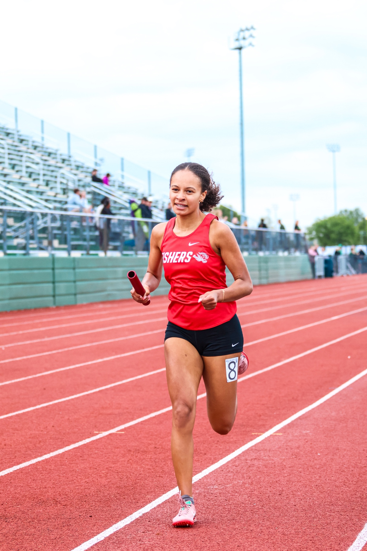 Track runner with baton