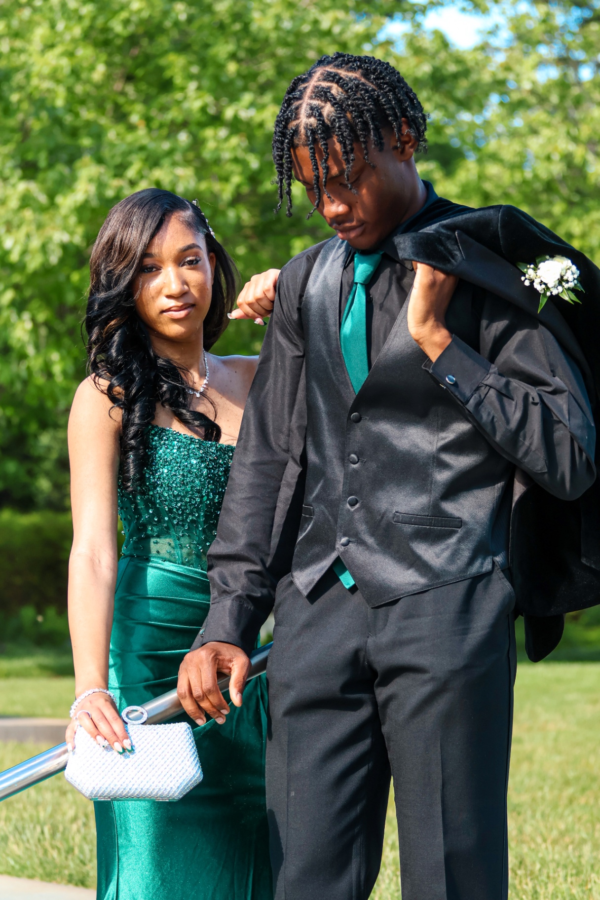 Prom couple with jacket over shoulder